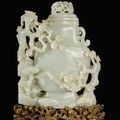 A large white jade 'prunus and lingzhi' vase and cover, Qing dynasty, Qianlong period