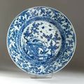 Plat rond en porcelaine blanche à décor en bleu - Epoque Kanghi (1666-1722)