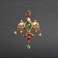 A fine gem-set gold pendant in the form of a Bird, Mughal India or Deccan, 17th Century