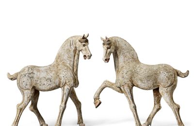 A pair of painted pottery figures of horses, Tang dynasty
