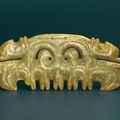 A very rare green jade toothed animal mask ornament, late Hongshan Culture, circa 3500-3000 BC