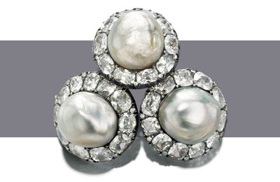 Exceptionally large natural pearls: A pair of natural pearl and diamond earrings & A natural pearl and diamond ring