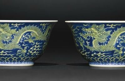 A fine pair of blue and yellow 'Dragon' bowls, Qianlong seal marks and period