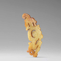 A very rare jade figural dragon pendant, Western Zhou Dynasty (c. 1046-771 B.C.E)