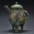 A rare bronze ritual tripod pouring vessel and cover, he, Late Shang dynasty-early Western Zhou dynasty, 11th century BC