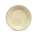 A finely carved and incised Ding 'fish' dish, Northern Song dynasty (960-1127)