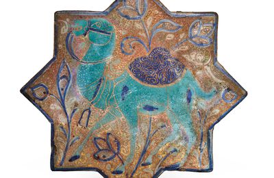 A Kashan lustre, turquoise and cobalt-blue star tile, Iran, late 13th-early 14th century
