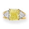 A colored diamond and diamond ring