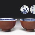 A pair of small Ming style iron-red and blue and white bowls - Kangxi six character mark and of the period 