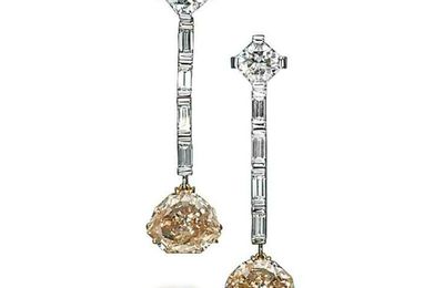 A pair of colored diamond earrings