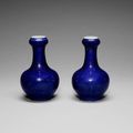 A pair of small blue-glazed garlic neck bottle vases, Kangxi four-character marks, 19th century