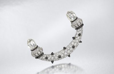 An Art Deco diamond, onyx and enamel brooch, attributed to Lacloche Frères, circa 1920 