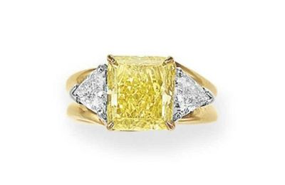 A colored diamond and diamond ring