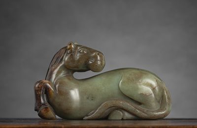A fine and rare large celadon jade recumbent horse, China, 17th-18th century