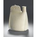 An unusual white stoneware flask in the form of a leather pouch. Liao Dynasty, 10th Century. 
