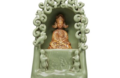 A 'Longquan' celadon-glazed and biscuit figure of a seated Guanyin, Yuan dynasty