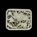 A reticulated white jade 'dragon' plaque, Ming dynasty