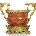 An ormolu-mounted gilt painted coral-ground porcelain cachepot, China, the porcelain with Daoguang seal mark and of the period