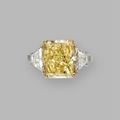 Platinum, 18 karat gold and fancy  yellow  diamond ring
