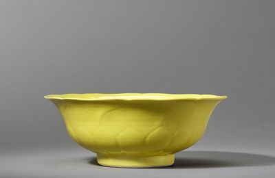 A fine and large lemon-yellow enamelled moulded 'lotus' bowl, Yongzheng six-character mark and of the period (1723-1735)