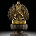 A large gilt-bronze figure of a multi-armed Avalokitesvara, Ming dynasty, 16th century