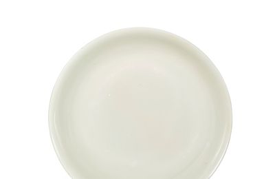 A white-glazed dish, Ming dynasty, Hongzhi six-character mark within a double circle in underglaze blue and of the period (1488-1505)