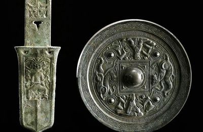 A rare ceremonial ge-halberd, West Zhou period; a mirror, Eastern Han dynasty & a "lion and grapevine" mirror, Tang dynasty 