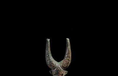 A bronze 'mythical beast' pole finial, Shang dynasty
