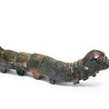 A rare gilt-bronze model of a silkworm, Han dynasty;