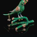 A gold and polychrome enamelled parrot perched on a branch, North India, 19th century