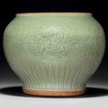 A Longquan celadon carved baluster jar, guan, early Ming dynasty, 15th century