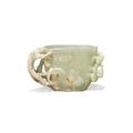 A finely carved greenish-yellow jade cup, Ming dynasty (1368-1644)