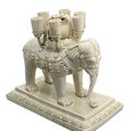 An important and very rare white-glazed ‘elephant’ candle stand, Sui-early Tang dynasty, 6th-7th century