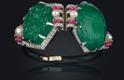 A pair of Art Deco emerald, natural pearl, ruby and diamond ear clips, Cartier