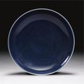 A blue-glazed dish. Incised Wanli mark and period