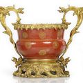 An ormolu-mounted gilt painted coral-ground porcelain cachepot, China, the porcelain with Daoguang seal mark and of the period