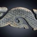 A large greyish-green jade dragon-form pendant, Warring States period, 4th century BC