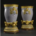 A fine pair of French Louis XVI style gilt-bronze mounted Sèvres lilac-grey porcelain vases "Tabouret" and liners