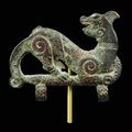 A bronze agraphe of a tiger catching a snake. China, Eastern Zhou dynasty, ca. 4th ct. BC.