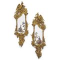 A pair of Louis XV style chinoiserie carved giltwood and reverse painted glass mirrors. French, circa 1870.  